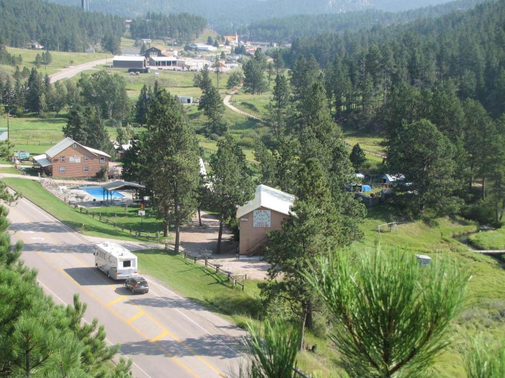 an aerial view of a town with a rv parked on a road at Black Hills Cabins at Quail's Crossing in Hill City
