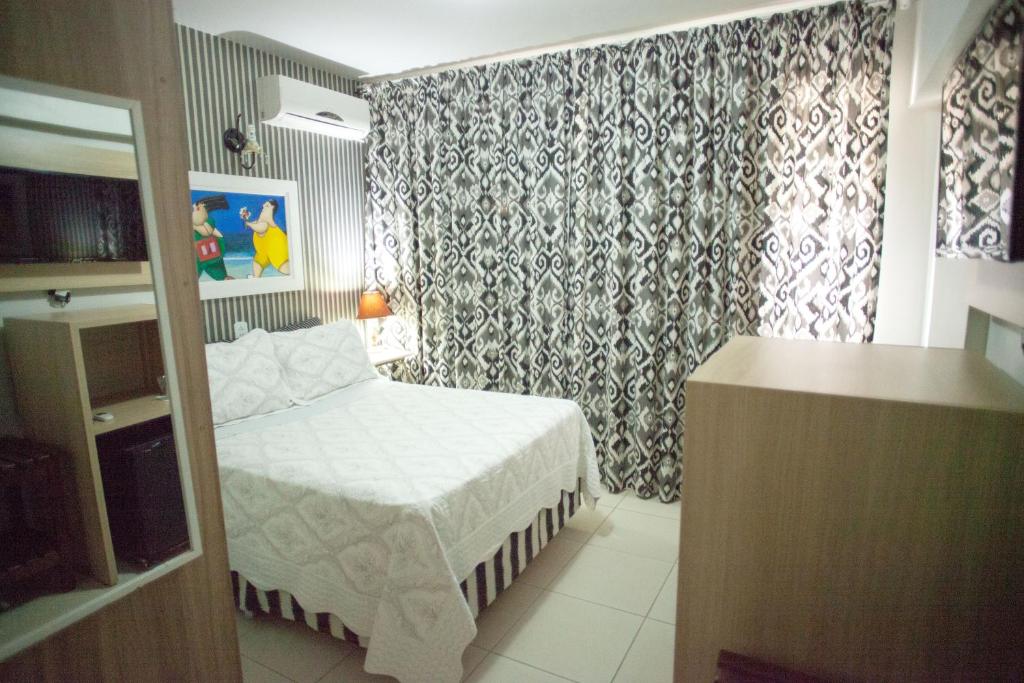 Postel nebo postele na pokoji v ubytování Royal Plaza Hotel