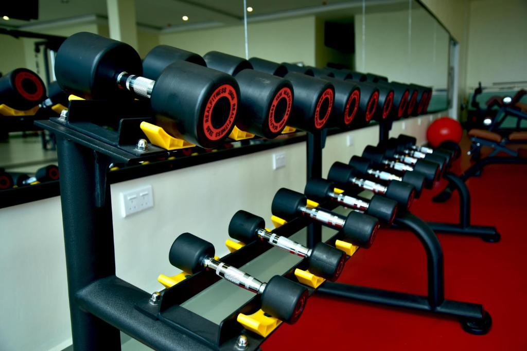 a row of dumbbells in a gym at Hotel Blue Sapphire in Dar es Salaam