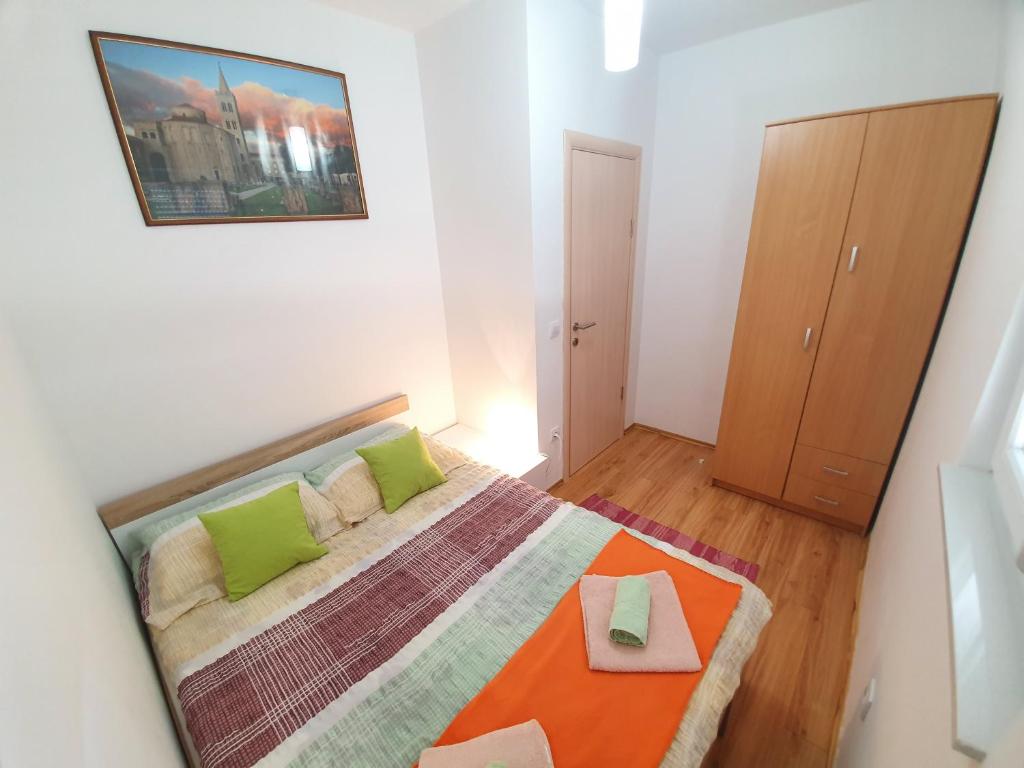 Postel nebo postele na pokoji v ubytování Apartments Lara