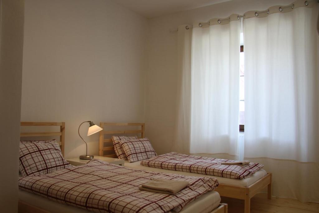 Postel nebo postele na pokoji v ubytování Dvůr Nové Zámky
