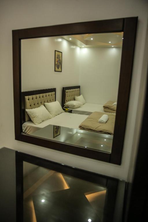 Letto o letti in una camera di Queen Pyramids View Inn