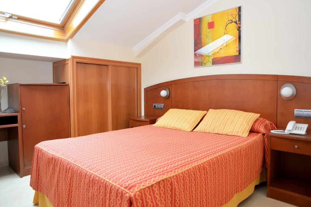 Postel nebo postele na pokoji v ubytování Hotel Portonovo