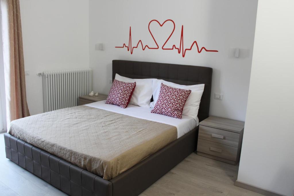Postel nebo postele na pokoji v ubytování Le Coccole