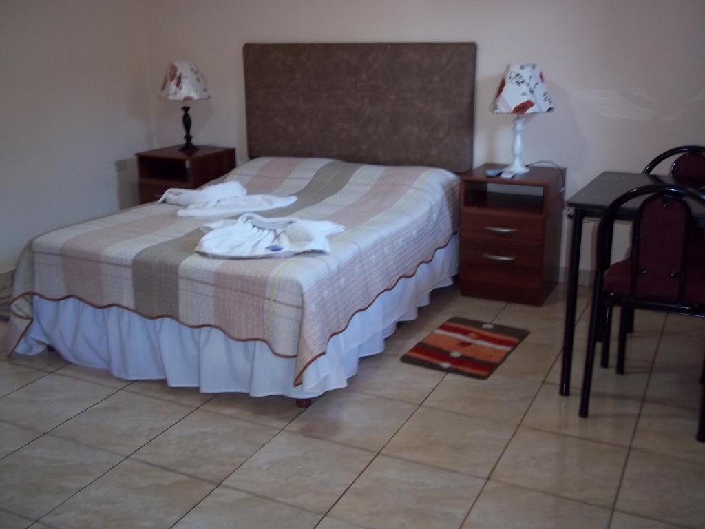 Postel nebo postele na pokoji v ubytování Posada Iguazu Royal
