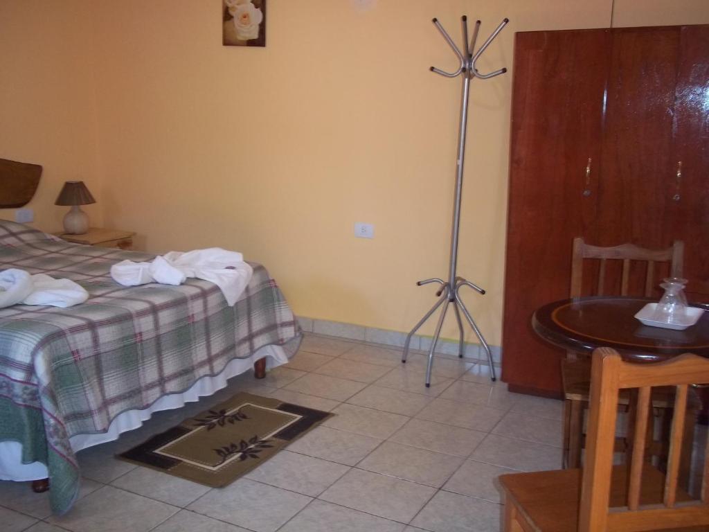 Postel nebo postele na pokoji v ubytování Posada Iguazu Royal