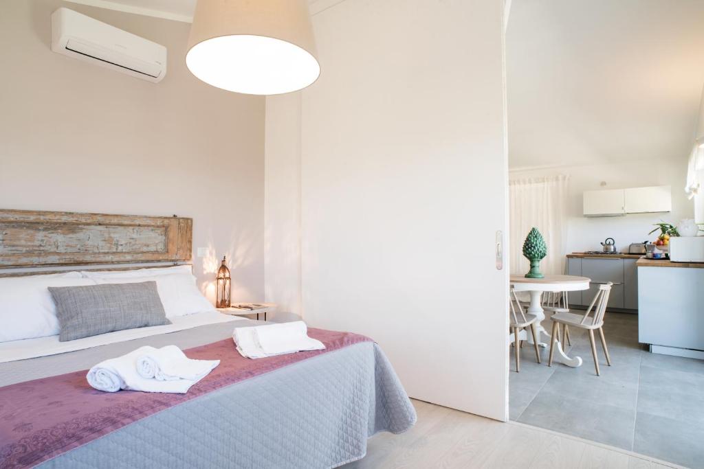 Postel nebo postele na pokoji v ubytování AGRITURISMO LA GHIGA