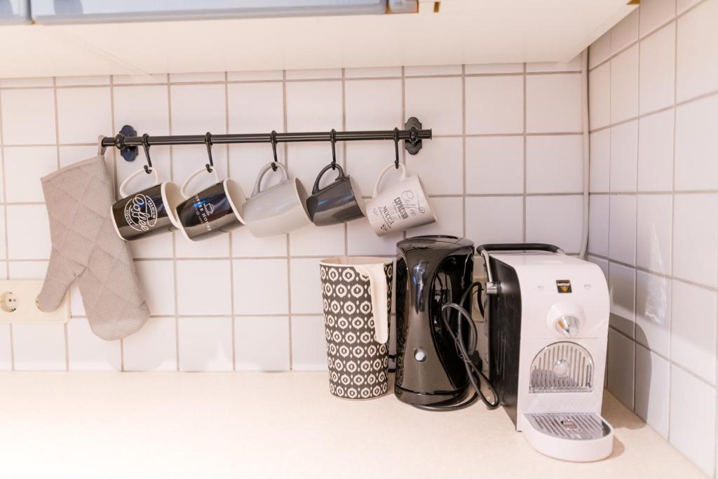 A kitchen or kitchenette at MOOKI Mountain & Pool Gerlitzen Apartment