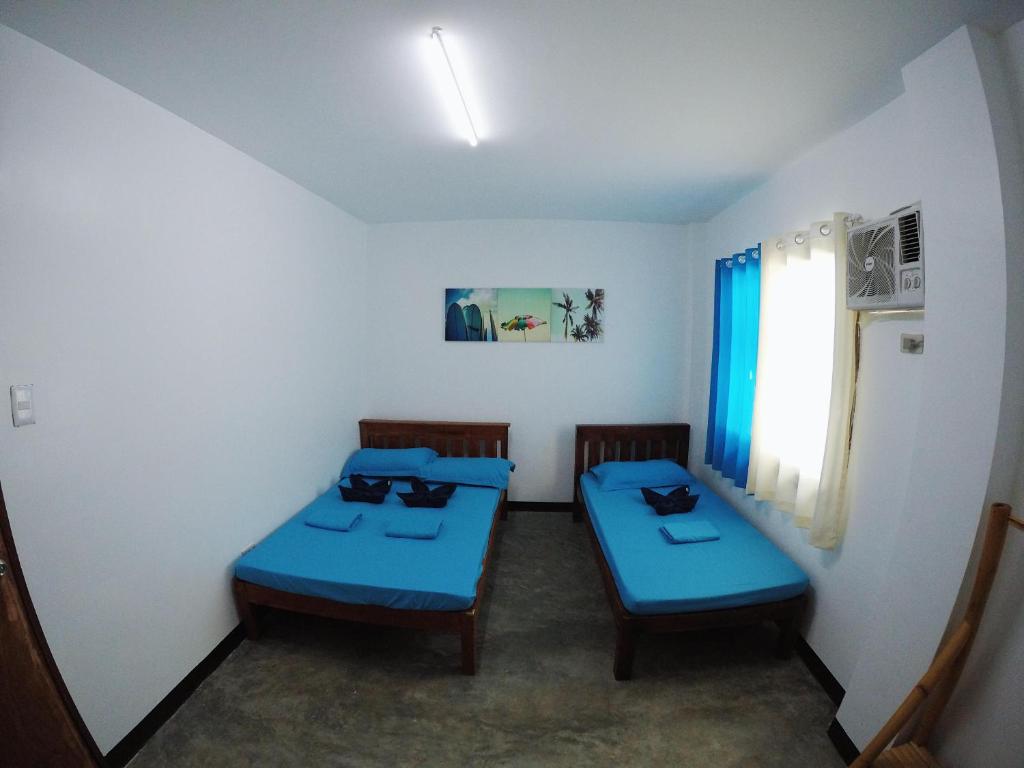 Postel nebo postele na pokoji v ubytování Tres Islas Hostel