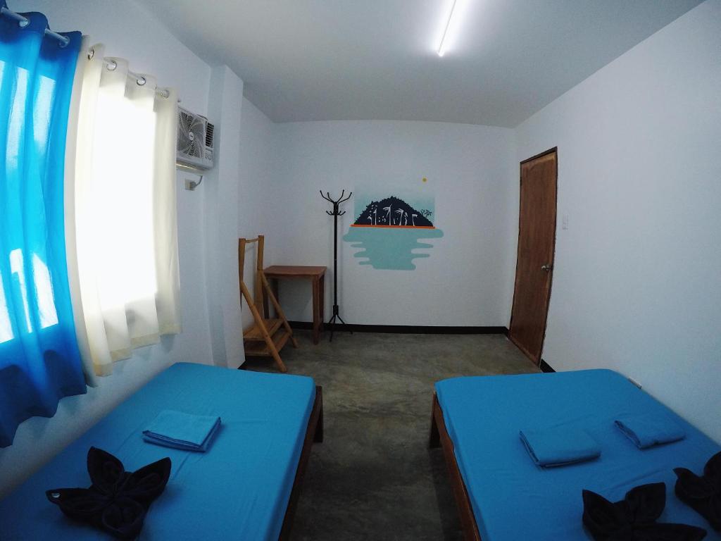 Postel nebo postele na pokoji v ubytování Tres Islas Hostel