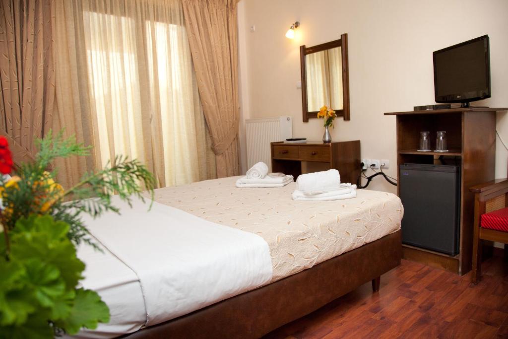 Postel nebo postele na pokoji v ubytování Akroyali Hotel & Villas