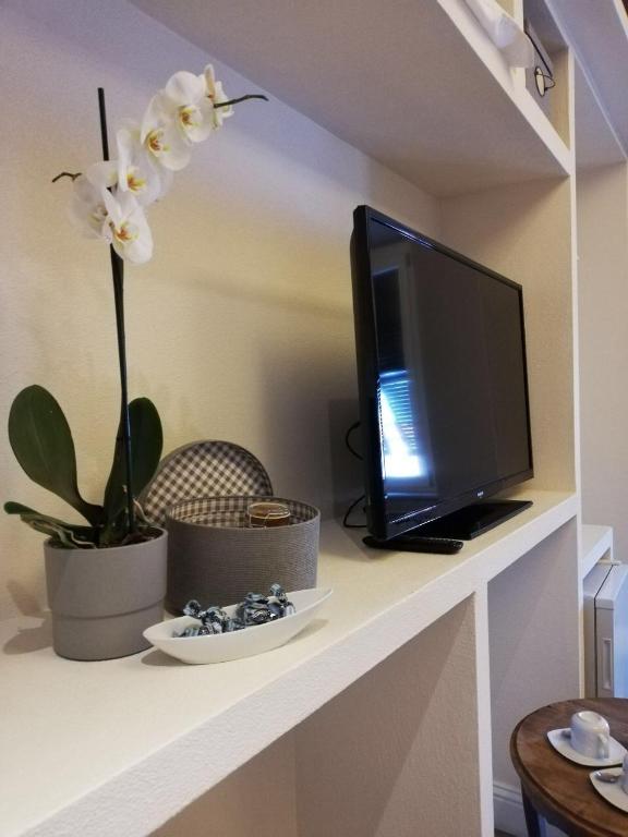 TV a/nebo společenská místnost v ubytování Affittacamere Joss