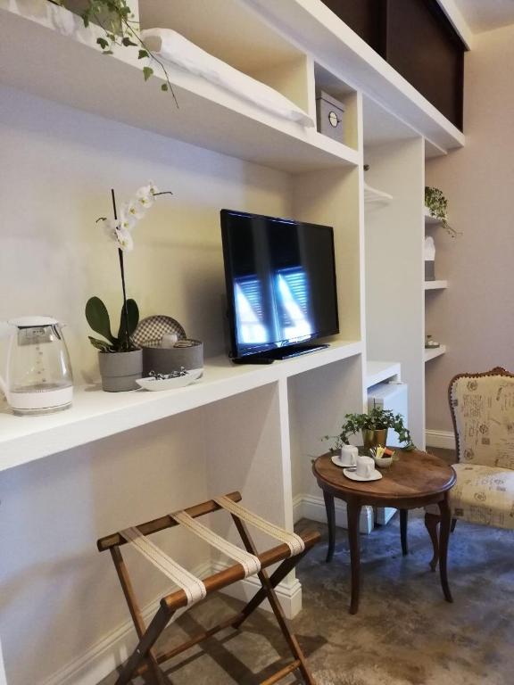 TV a/nebo společenská místnost v ubytování Affittacamere Joss