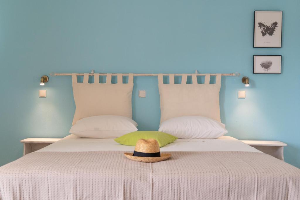 a hat sitting on top of a bed at Kassiani Studios in Plakias
