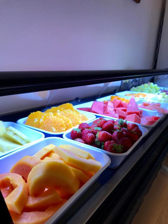 a display case filled with different types of food at Hostal Casa Mercedes in Nerja