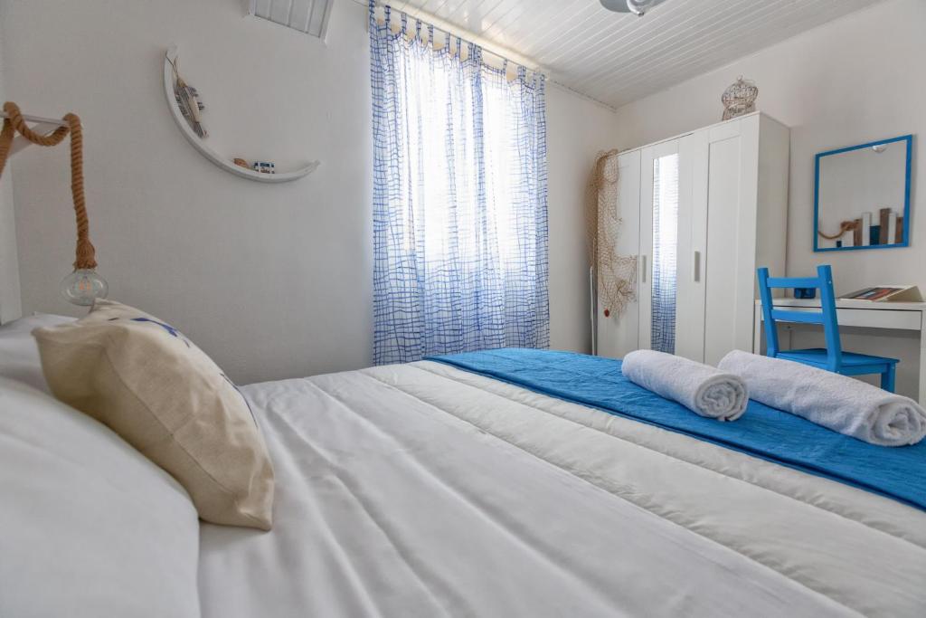 Postel nebo postele na pokoji v ubytování Casa Memù