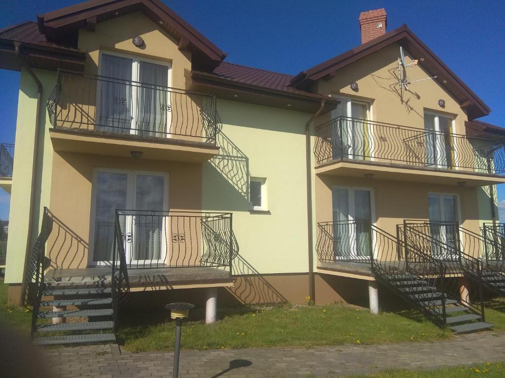 a house with balconies on the side of it at Willa Arkadia in Władysławowo