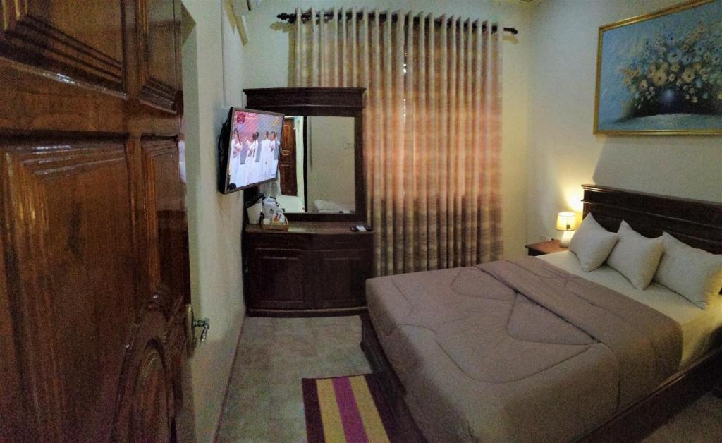 Postel nebo postele na pokoji v ubytování holidays hotel
