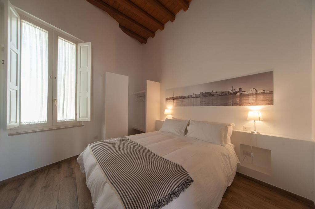 Postel nebo postele na pokoji v ubytování La Soffitta Covelli