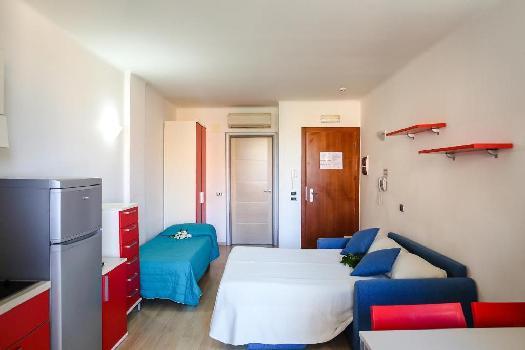 Кровать или кровати в номере Residence Mediterraneo
