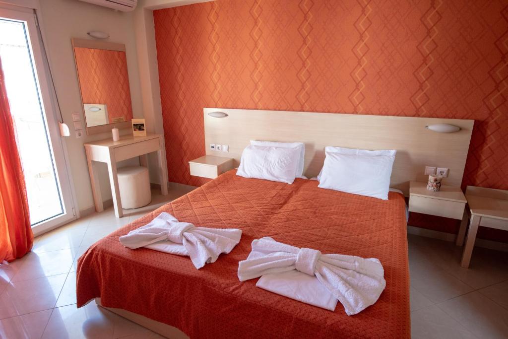 Postel nebo postele na pokoji v ubytování Oniro Rooms & Suites