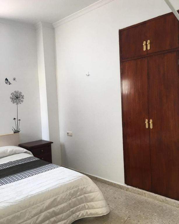 Postel nebo postele na pokoji v ubytování Hostal Gutierrez