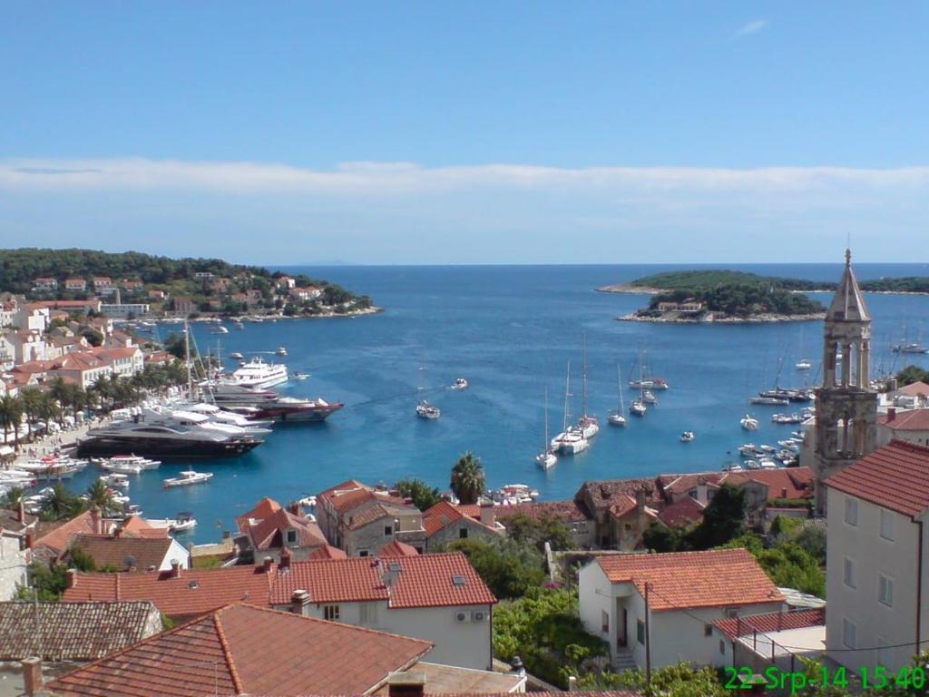 a view of a harbor with boats in the water at Orange studio Eni in Hvar