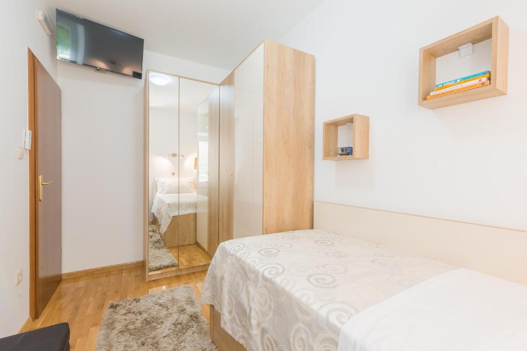 Posteľ alebo postele v izbe v ubytovaní Apartman Grgur