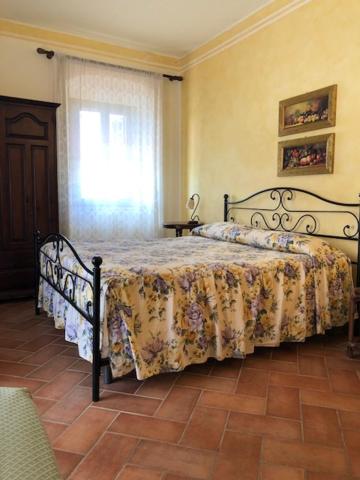 Кровать или кровати в номере Country Villas Fattoria Le Guardiole