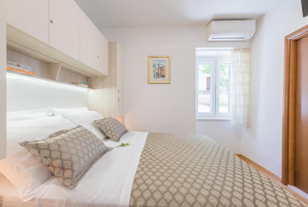 Posteľ alebo postele v izbe v ubytovaní Apartman Grgur