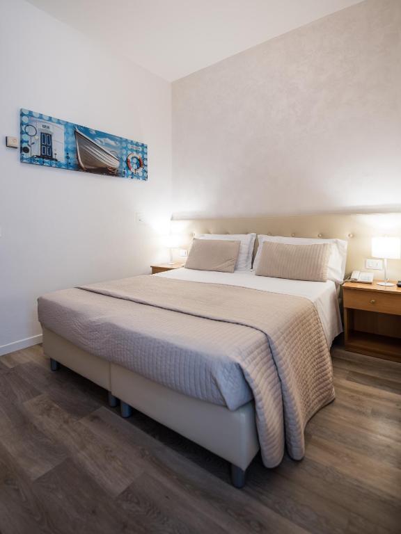 Postel nebo postele na pokoji v ubytování Hotel Touring