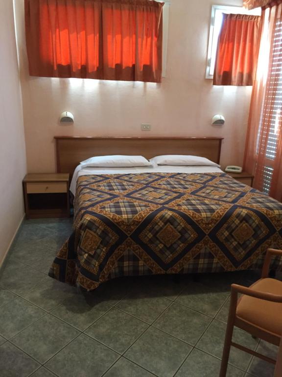 Postel nebo postele na pokoji v ubytování Hotel Ambasciatori