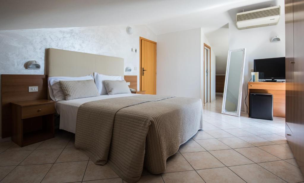 Postel nebo postele na pokoji v ubytování Hotel Touring