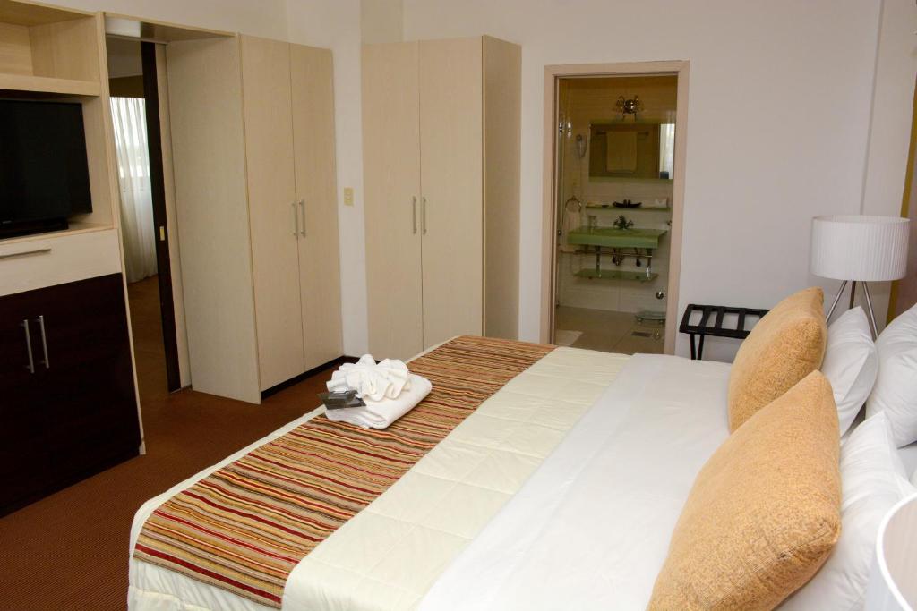 Postel nebo postele na pokoji v ubytování leclub resort hotel