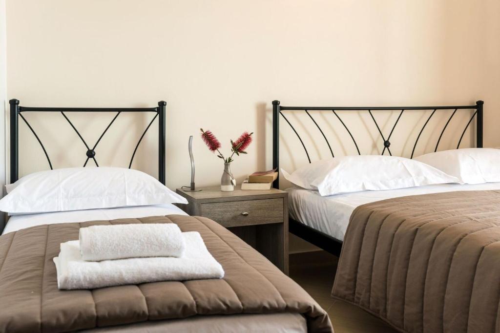 Voodi või voodid majutusasutuse Anesis Hotel toas