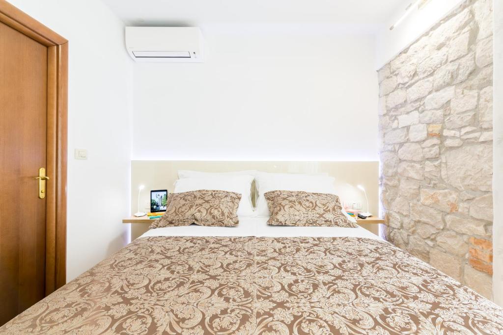 Posteľ alebo postele v izbe v ubytovaní Apartman Grgur