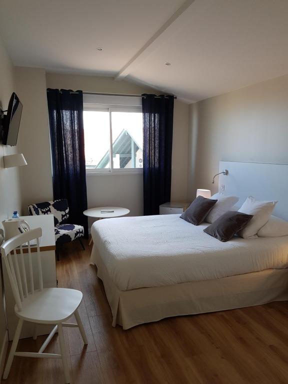 Postel nebo postele na pokoji v ubytování Hôtel Au Bon Coin
