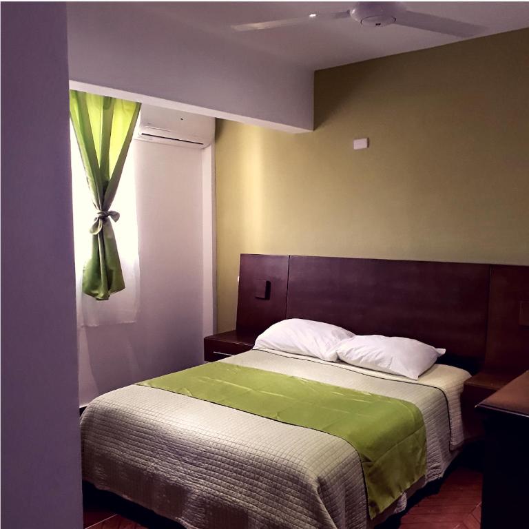 Letto o letti in una camera di Figaro Hotel Samana