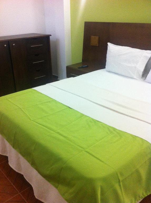 Letto o letti in una camera di Figaro Hotel Samana