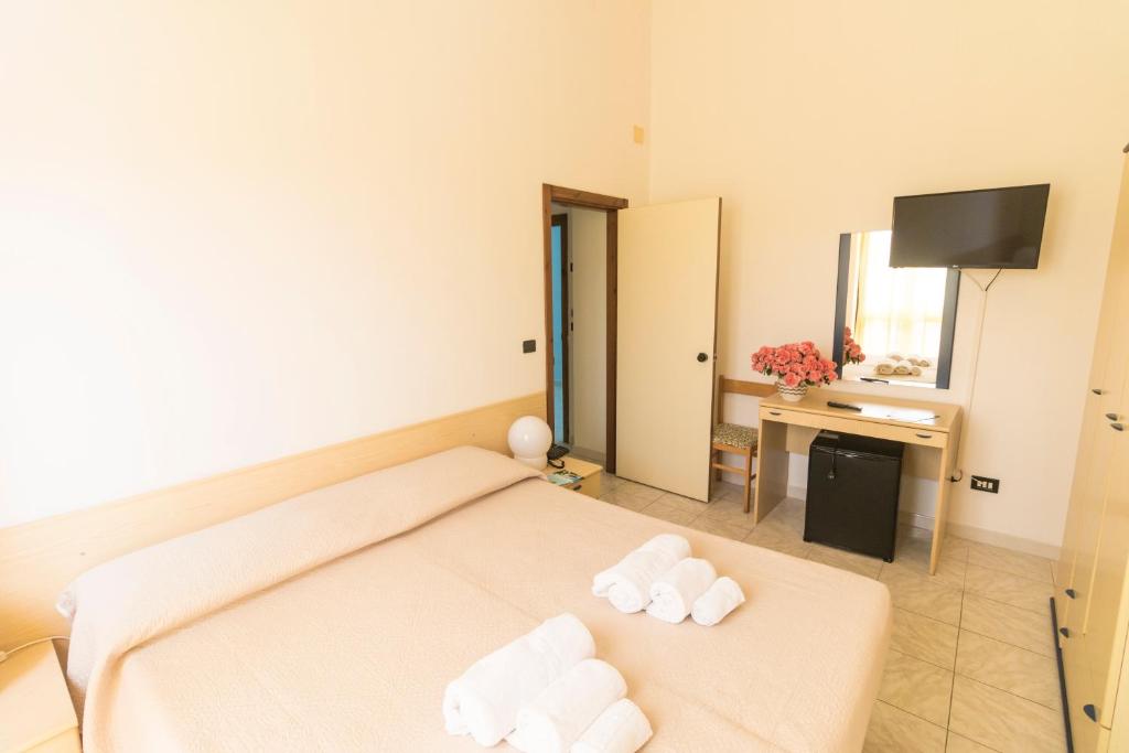 Postel nebo postele na pokoji v ubytování Albergo Palazzo