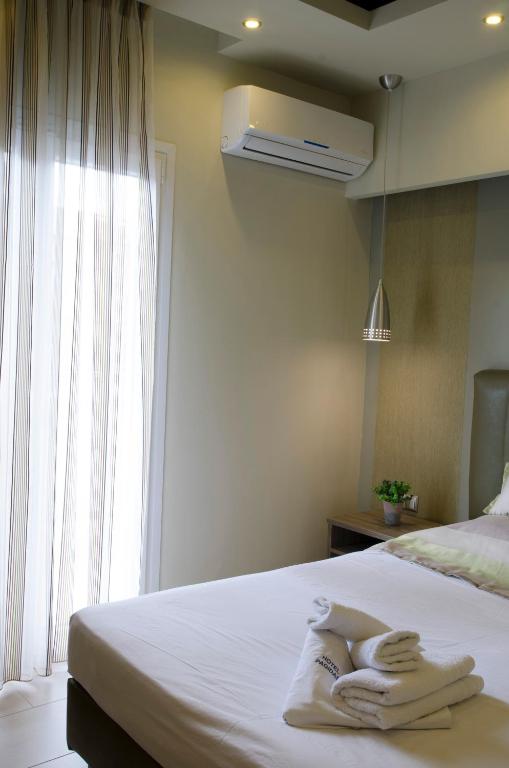 Postel nebo postele na pokoji v ubytování Aparthotel Pagidas