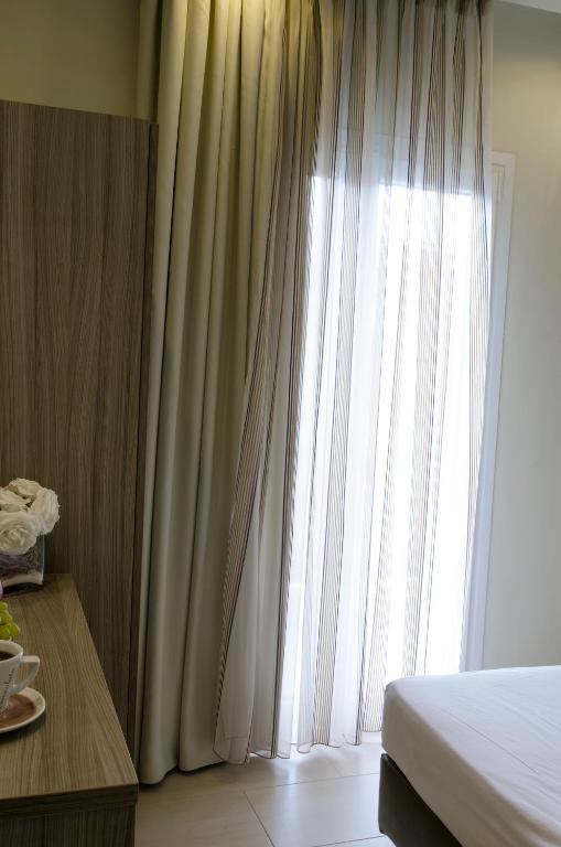 Postel nebo postele na pokoji v ubytování Aparthotel Pagidas