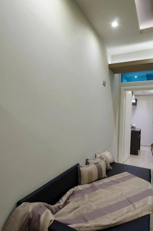Postel nebo postele na pokoji v ubytování Aparthotel Pagidas