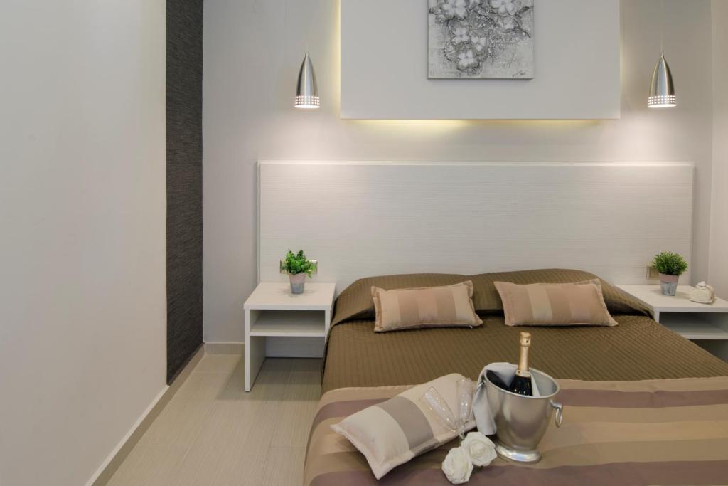 Postel nebo postele na pokoji v ubytování Aparthotel Pagidas