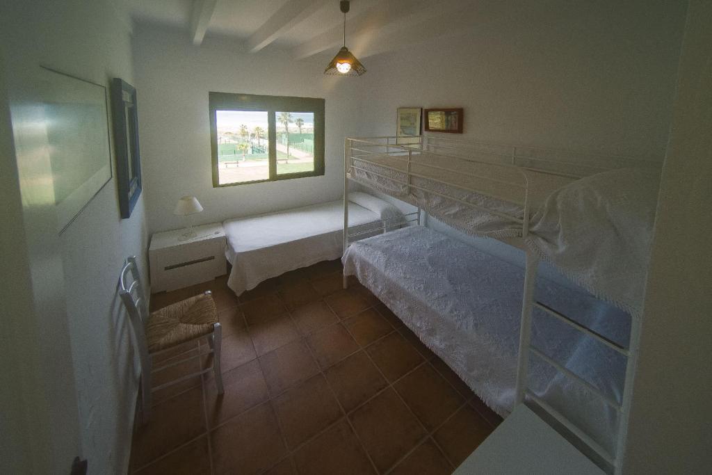 Posteľ alebo postele v izbe v ubytovaní Casa En Primera Linea De Playa