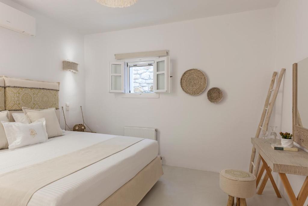 Postel nebo postele na pokoji v ubytování Amalgam Homes Paros