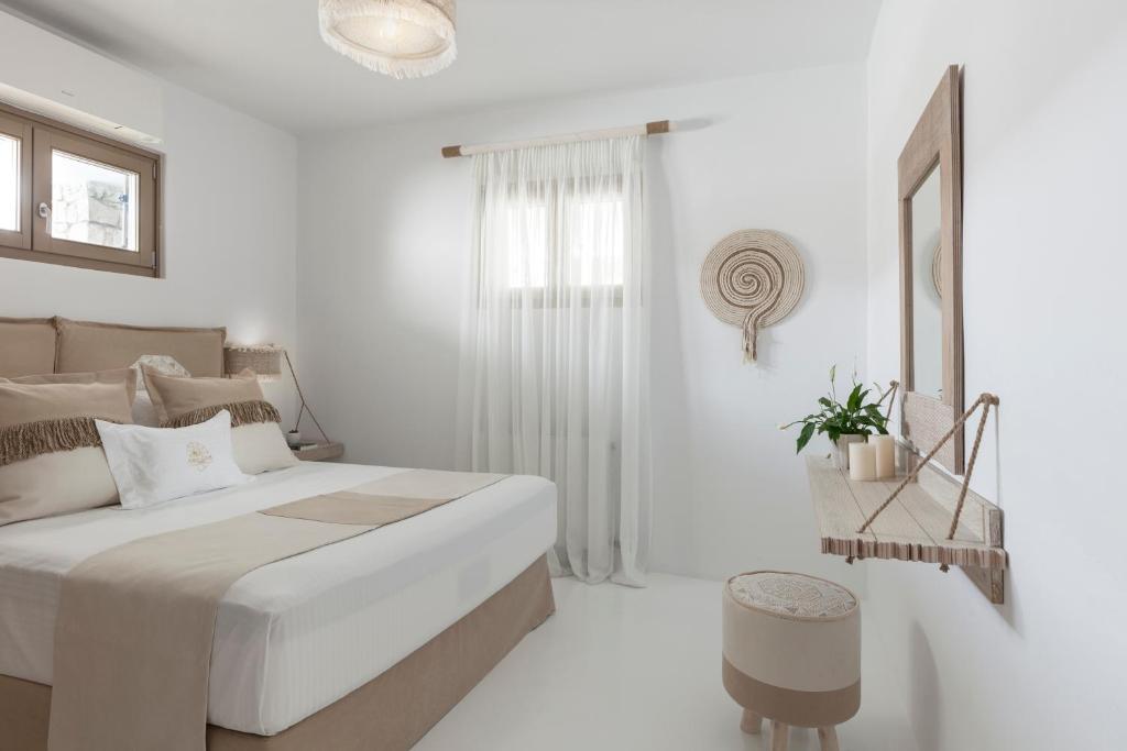 Postel nebo postele na pokoji v ubytování Amalgam Homes Paros