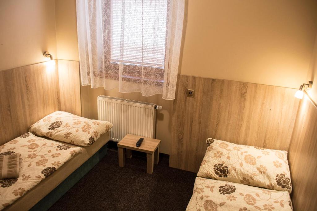 Postel nebo postele na pokoji v ubytování Penzion Krmelec