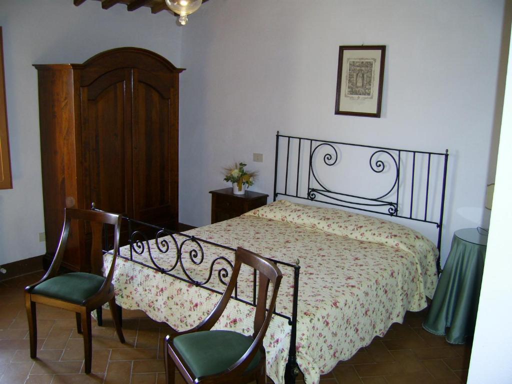 Postel nebo postele na pokoji v ubytování Agriturismo Fattoria Di Corsano
