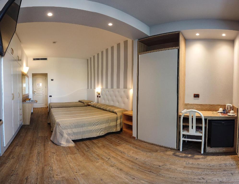 Postel nebo postele na pokoji v ubytování Hotel Derby Exclusive